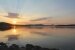 Sonnenuntergang auf einem Vermont Fluss