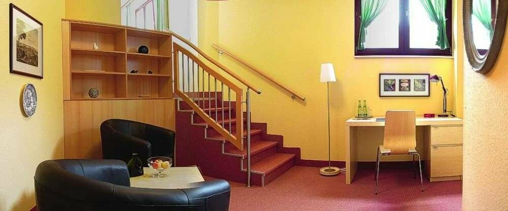 SItz- und Arbeitsbereich in einem unserer Doppelzimmer DELUXE