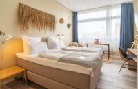 Classic Doppelzimmer (25x) Modernes Standardzimmer für 1–2 Personen 180 cm breites Doppelbett Bad mit Dusche, Rituals-Produkten Teilweise mit Schreibtisch & Safe Ideal für Kurzaufenthalte