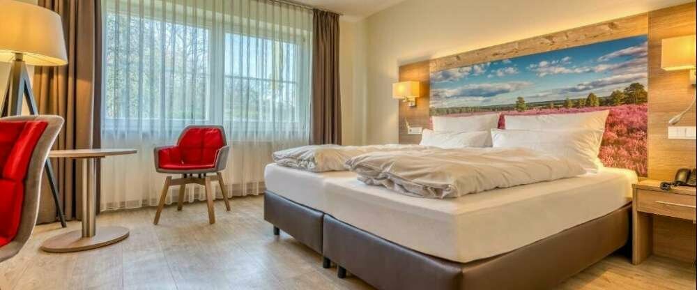 Dieses Doppelzimmer verfügt über Kabel-TV und ein eigenes Bad.