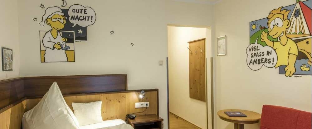 Freundlich gestaltetes Einzelzimmer