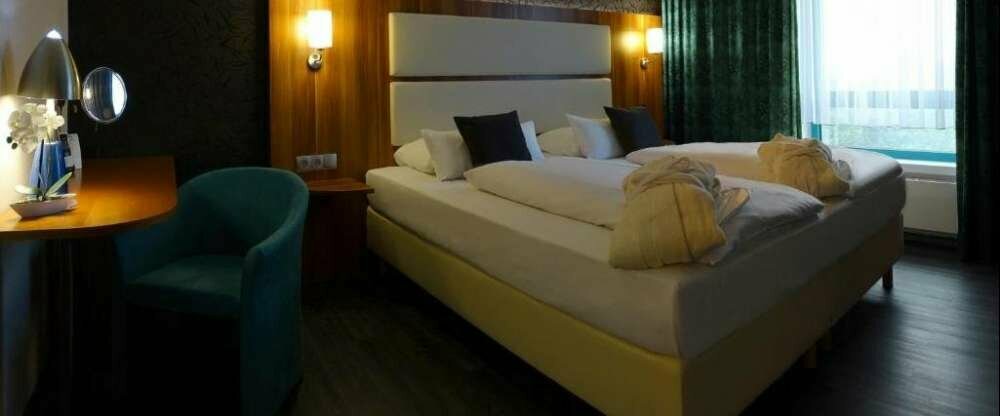 Komfort-Vierbettzimmer mit Balkon