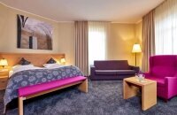 Die Premiumzimmer bieten einen luxuriösen Aufenthalt mit erstklassigen Annehmlichkeiten und stilvoller Einrichtung. Genießen Sie Ihren Aufenthalt in diesem exklusiven Zimmer und lassen Sie sich verwöhnen.