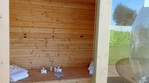 Im privaten Wellness-Garten erwartet Sie eine eigene Sauna.