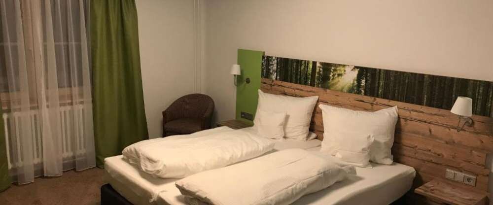 Das Doppelzimmer Beracker verfügt teilweise über einen Balkon mit Ausblick in die umliegende Natur und Landschaft.